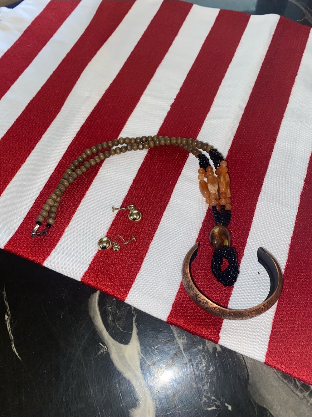 Trio of accessories: necklace, bracket, and earrings